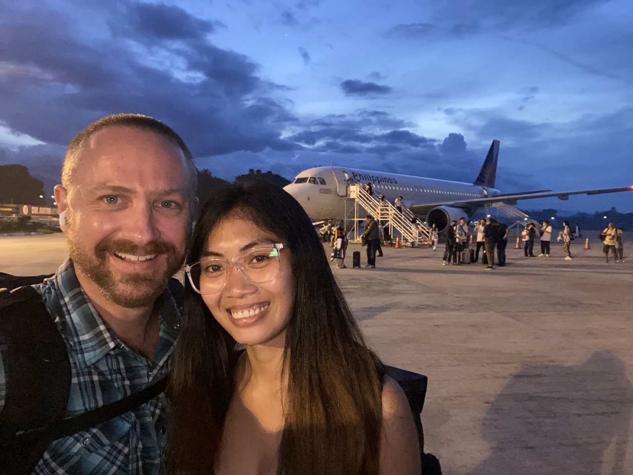 BC and Rose at an airport, ready to travel